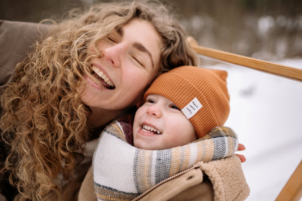 Mother and son outside on winter day