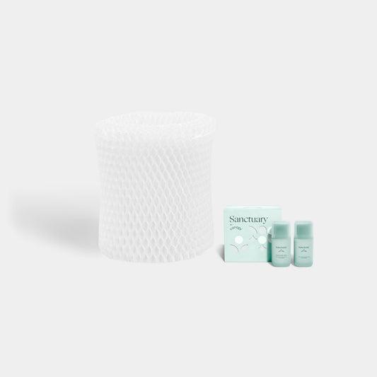 Bedside Humidifier Filter & Aroma set featuring a white mesh replacement filter alongside three Sanctuary essential oil bottles with mint-colored packaging and aromatherapy tablets for optimal air moisture and fragrance diffusion