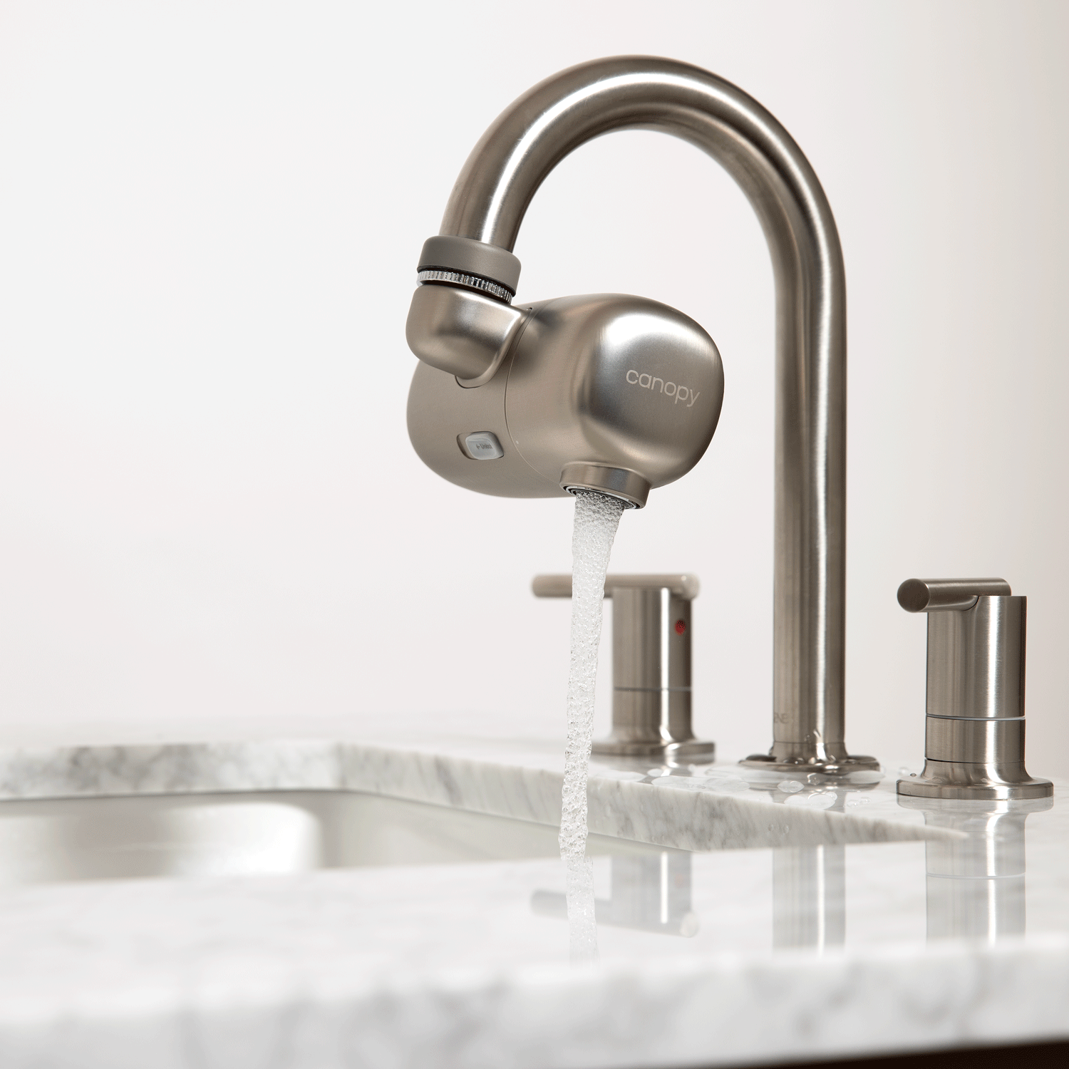 Faucet Filter in Brushed Nickel showcasing the Face Fountain and the 360 degree Swivel features