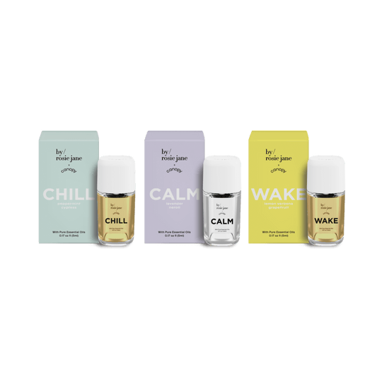 by/rosie jane Portable Subscription featuring three essential fragrance oils: Chill in mint green packaging, Calm in soft lavender, and Wake in vibrant yellow. Each bottle includes matching box and clear glass container with premium oil blend. Available at Canopy.