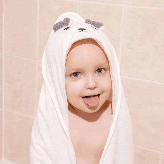Child wearing Canopy's baby towel after a bath