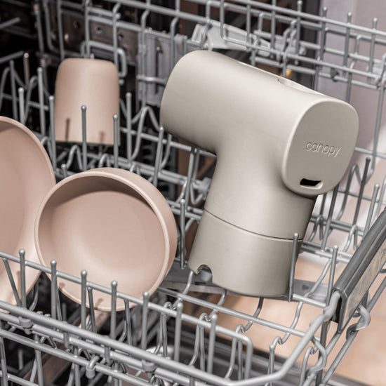 Bath Tub Filter in Oat at the top rack of the dishwasher next to tan dishes