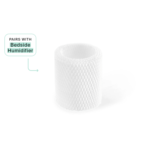 Bedside Humidifier Filter featuring a cylindrical white mesh design with diamond pattern texture, compatible with standard bedside humidifier models. Replacement filter shown in upright position against white background with product pairing indicator.