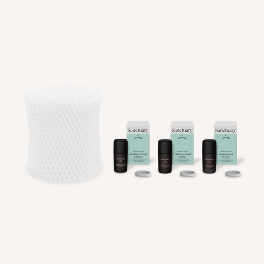 Bedside Humidifier Filter & Aroma set featuring a white mesh replacement filter alongside three Sanctuary essential oil bottles with mint-colored packaging and aromatherapy tablets for optimal air moisture and fragrance diffusion