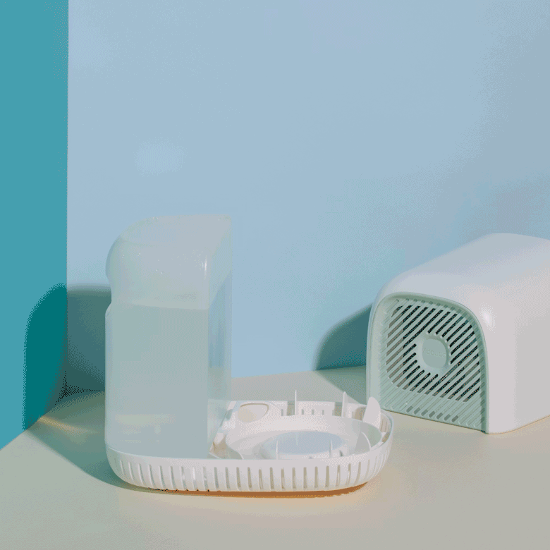 Bedside Humidifier Filter & Aroma displayed in parts showing the white curved base unit, removable filter compartment, and ventilation cover against a minimalist pastel background with turquoise accent wall