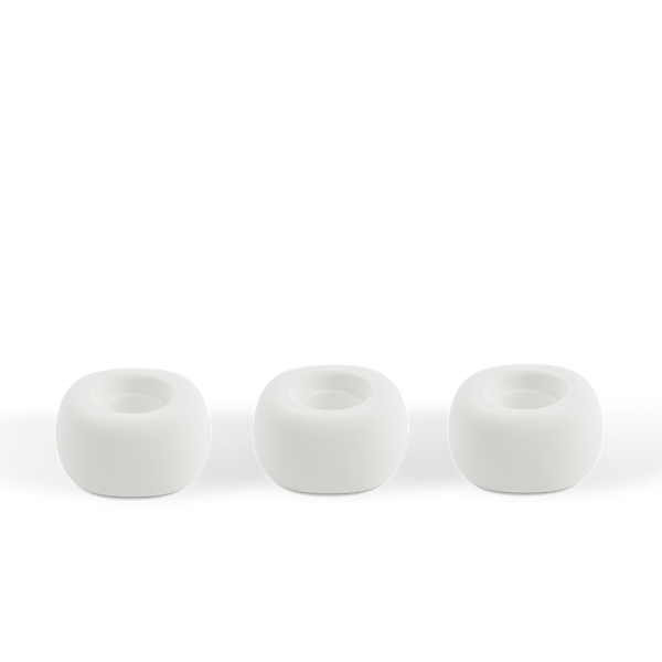 Three white ceramic Diffusion Well vessels arranged in a row against a white background, designed for long-lasting aromatherapy diffusion with the Canopy Diffuser. Diffusion Well 3-Pack by Canopy.