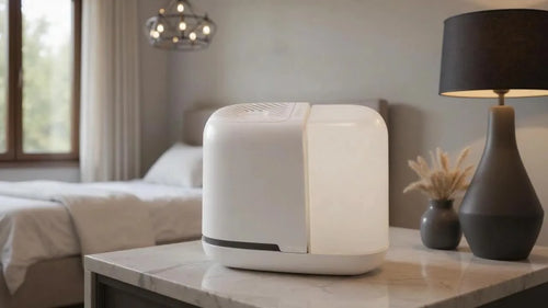 White Canopy Bedside Humidifier 2.0 on bedroom table next to modern black lamp