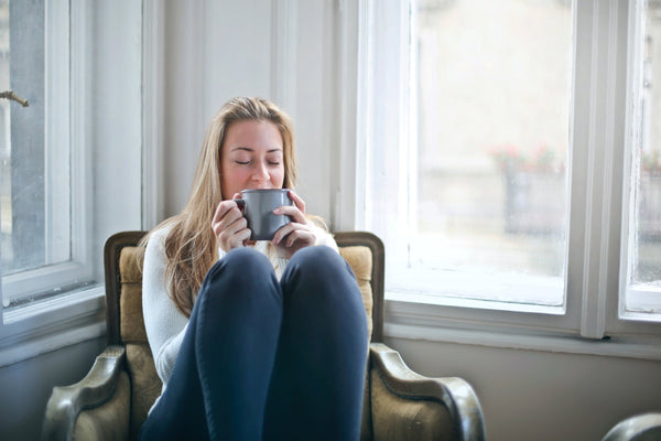 Woman at home with tea