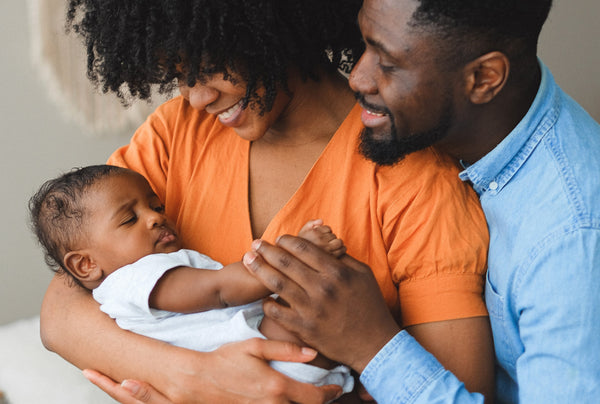 Couple with sleeping baby