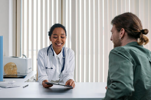 Doctor consulting with patient in office