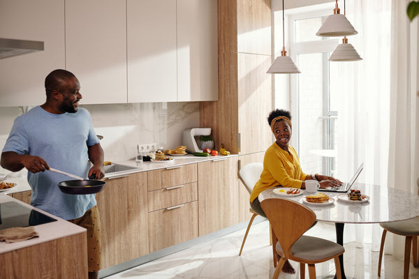 Couple in clean, comfortable kitchen