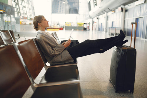 Woman using a portable humidifier at airport