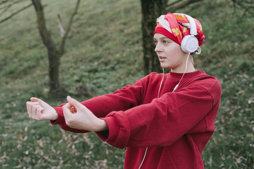 Female cancer patient exercising outdoors