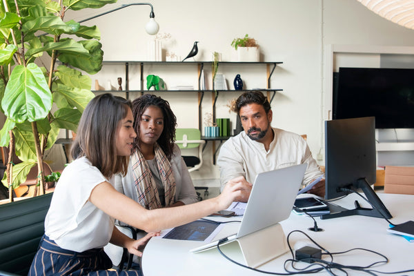 Colleagues working together in modern workspace