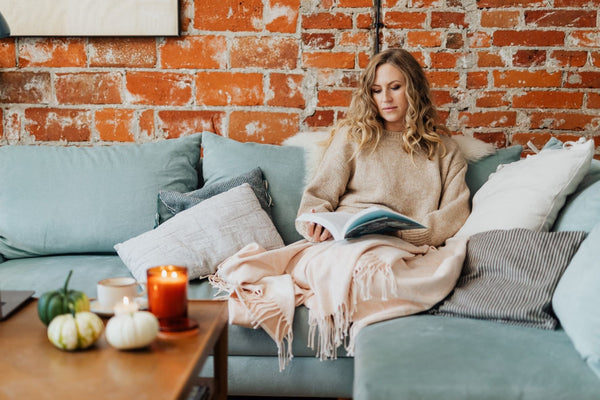 Woman relaxing in comfortable room