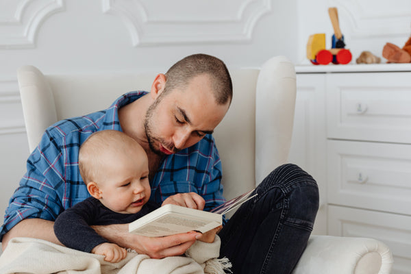 Father reading to baby