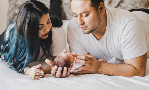 Parents with sleeping newborn