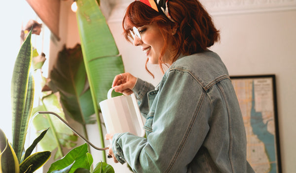 Woman watering houseplants