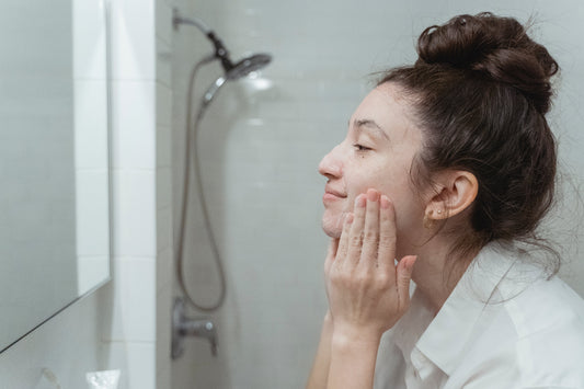 Woman taking care of skin in bathroom