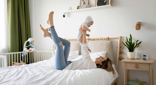 Mother and baby in clean, bright bedroom