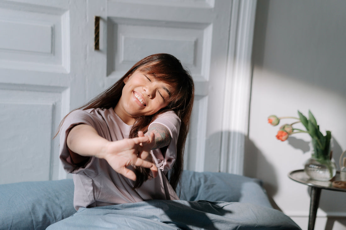 Woman waking up after restful night's sleep
