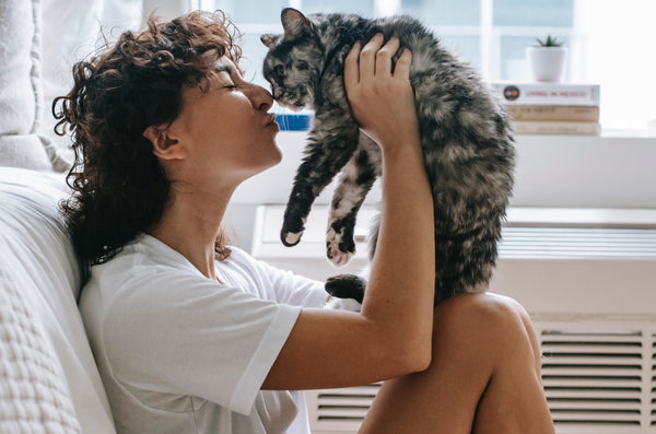 Woman with cat in apartment