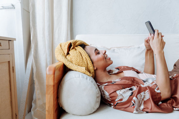 Woman on sofa after shower