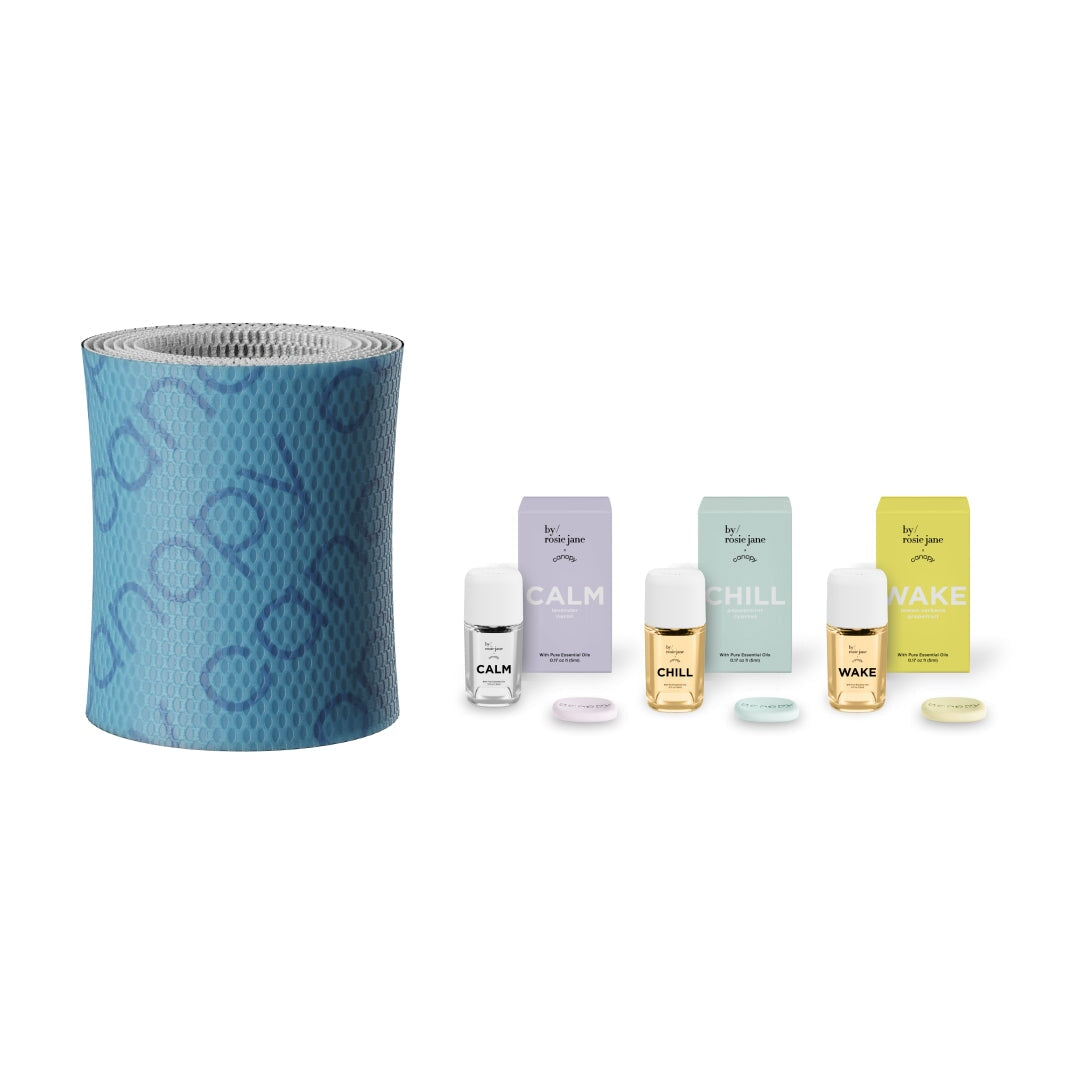 By/rosie Jane Aroma Kit featuring a blue textured filter and three aromatherapy oil sets - Calm, Chill, and Wake - with corresponding filter discs for personalized scent experiences. Complete with 2.0 Filter Subscription. By Canopy.
