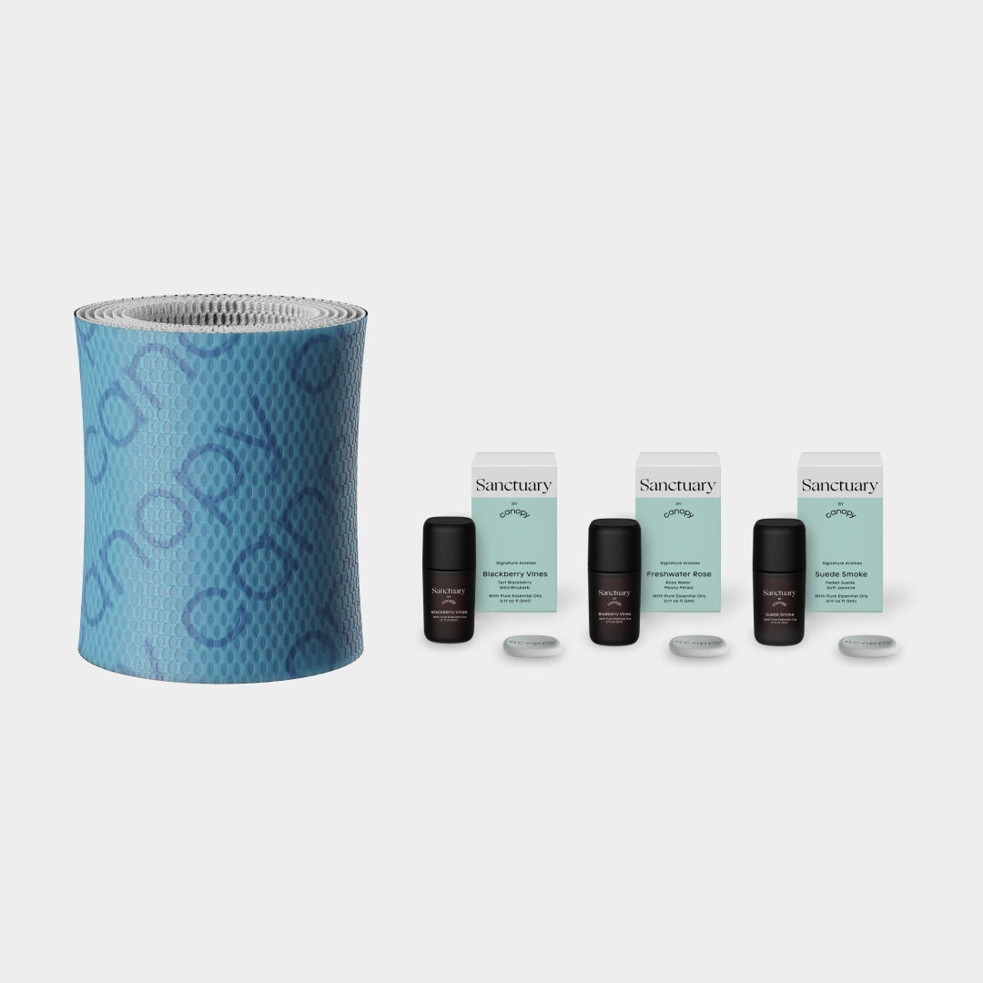 Sanctuary Aroma Kit + 2.0 Filter Subscription featuring a textured blue cylindrical humidifier filter and three sets of essential oil bottles with replacement filters for continuous aromatherapy experience by Canopy