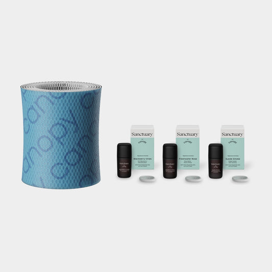 Sanctuary Aroma Kit + 2.0 Filter Subscription featuring a textured blue cylindrical humidifier filter and three sets of essential oil bottles with replacement filters for continuous aromatherapy experience by Canopy