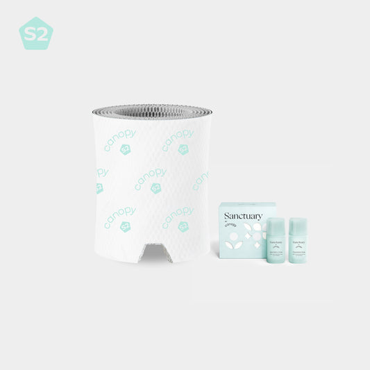 Bedside Humidifier Device Filter 2.0 & Aroma set featuring a blue textured filter roll alongside three Sanctuary aromatherapy bottles with mint-colored packaging boxes, arranged against a white background for optimal air purification and fragrance diffusion
