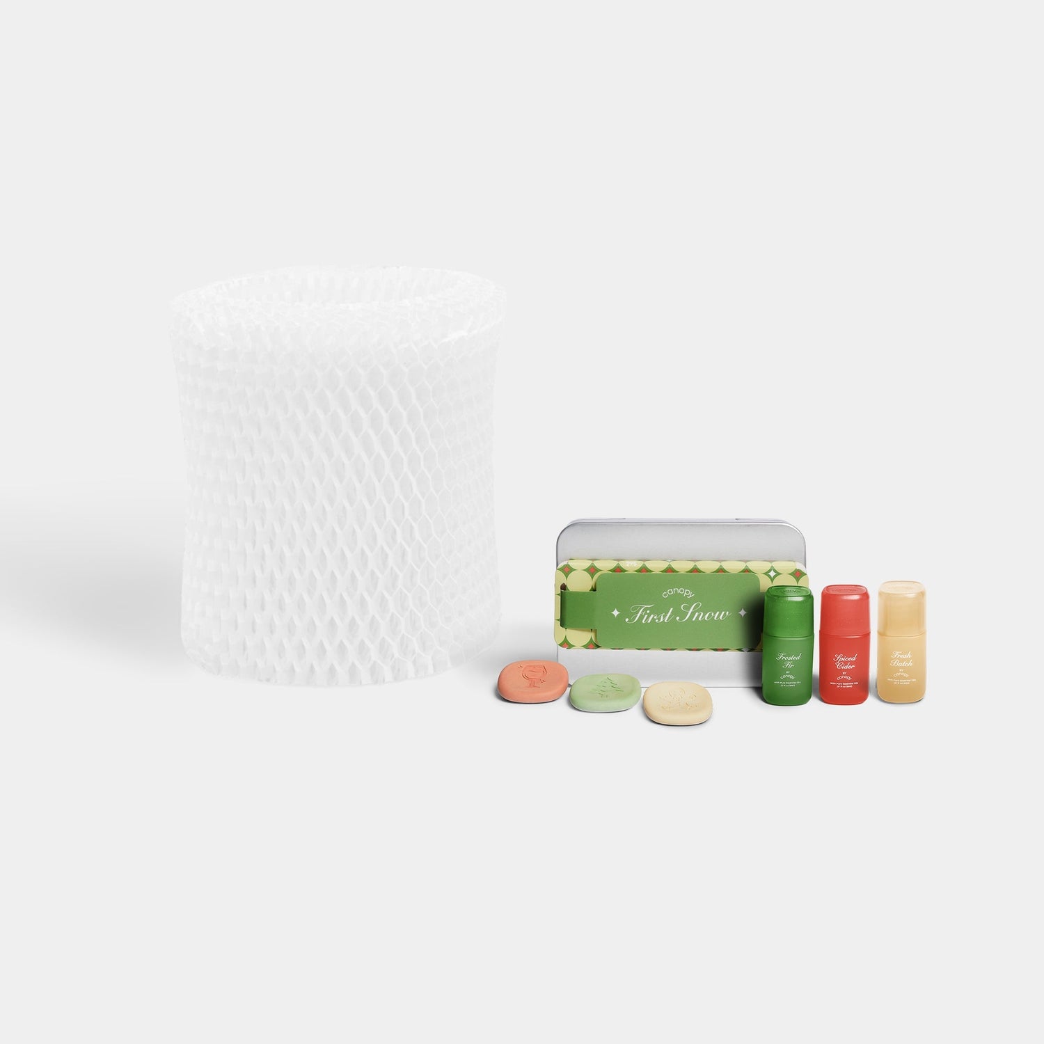 Bedside Humidifier Filter & Aroma set featuring a white mesh replacement filter alongside three Sanctuary essential oil bottles with mint-colored packaging and aromatherapy tablets for optimal air moisture and fragrance diffusion