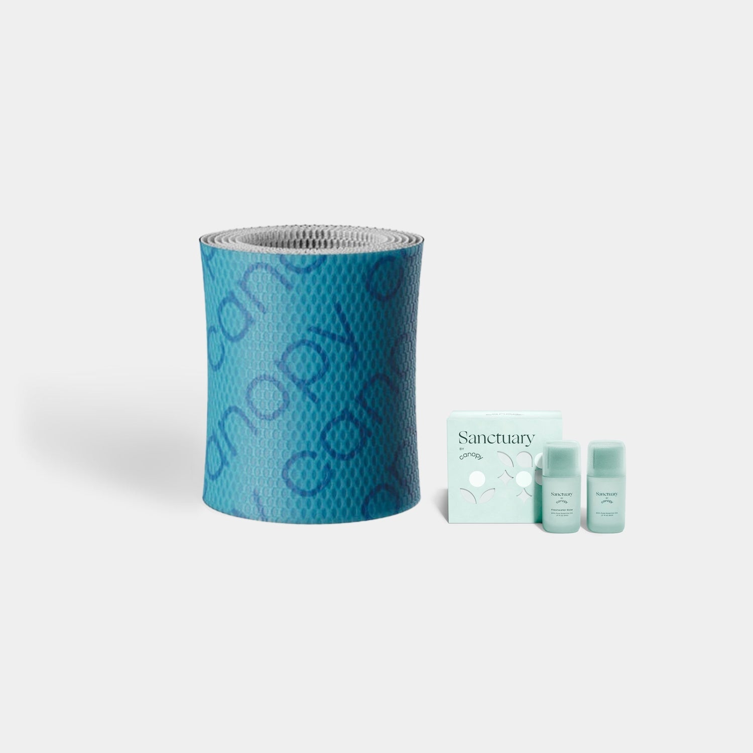 Bedside Humidifier Device Filter 2.0 & Aroma set featuring a blue textured filter roll alongside three Sanctuary aromatherapy bottles with mint-colored packaging boxes, arranged against a white background for optimal air purification and fragrance diffusion