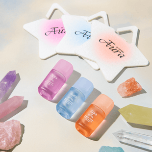 Aura Aroma Kit | Lifestyle, all three aromas laying next to crystals and Affirmation Felt Diffusers