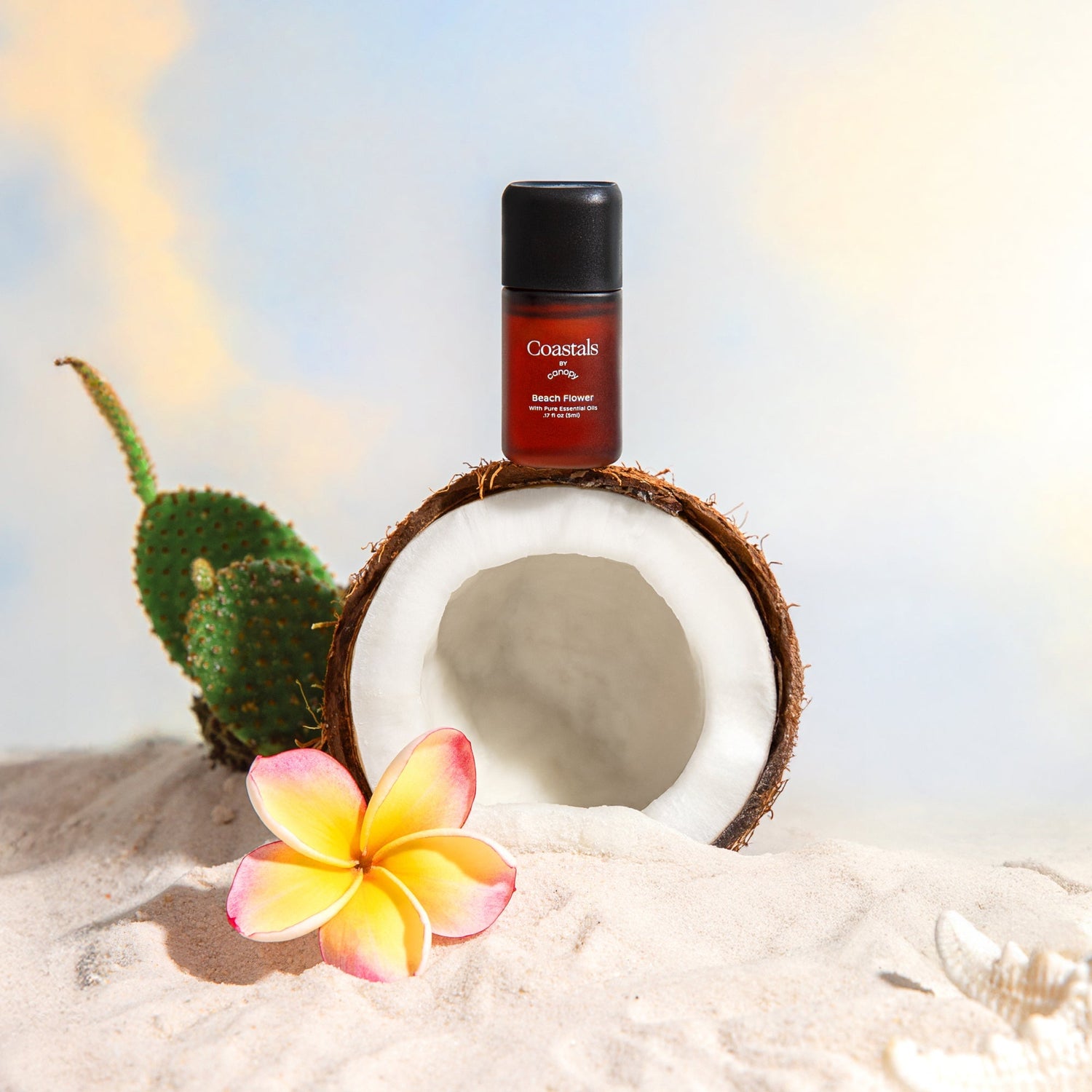 Beach Flower Aroma | Lifestyle, Aroma Bottle pictured in a beach setting with a coconut and flower