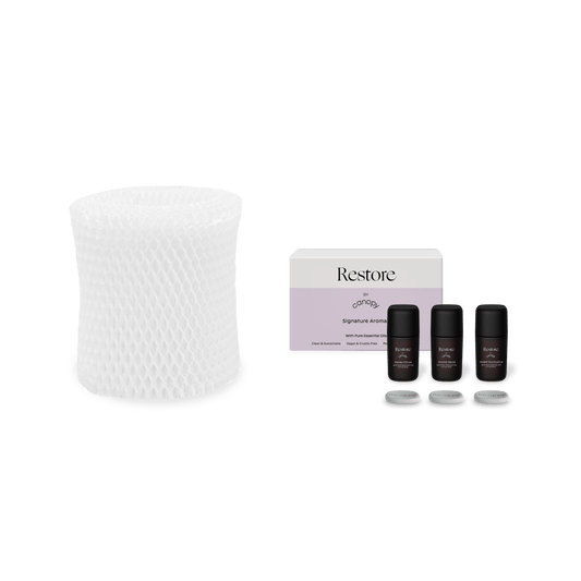 Restore Aroma Kit and Bedside Filter Subscription featuring a white cylindrical humidifier filter with diamond pattern texture alongside three black essential oil bottles in premium packaging. Complete aromatherapy wellness set for better sleep and relaxation by Canopy.