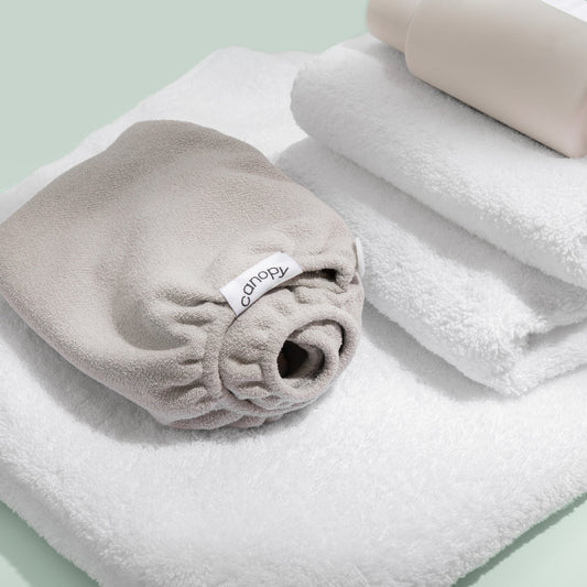  Lifestyle, In use, folded next to a stack of white bath towels