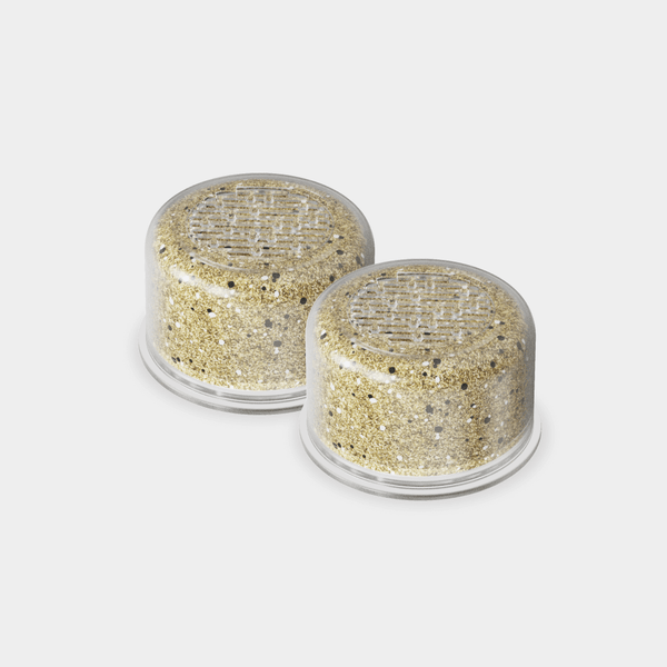 Two circular replacement filters in beige with a mesh pattern design, compatible with Handheld Duo Filter 2-Pack. Features durable construction and efficient filtering technology for optimal water purification by Canopy.