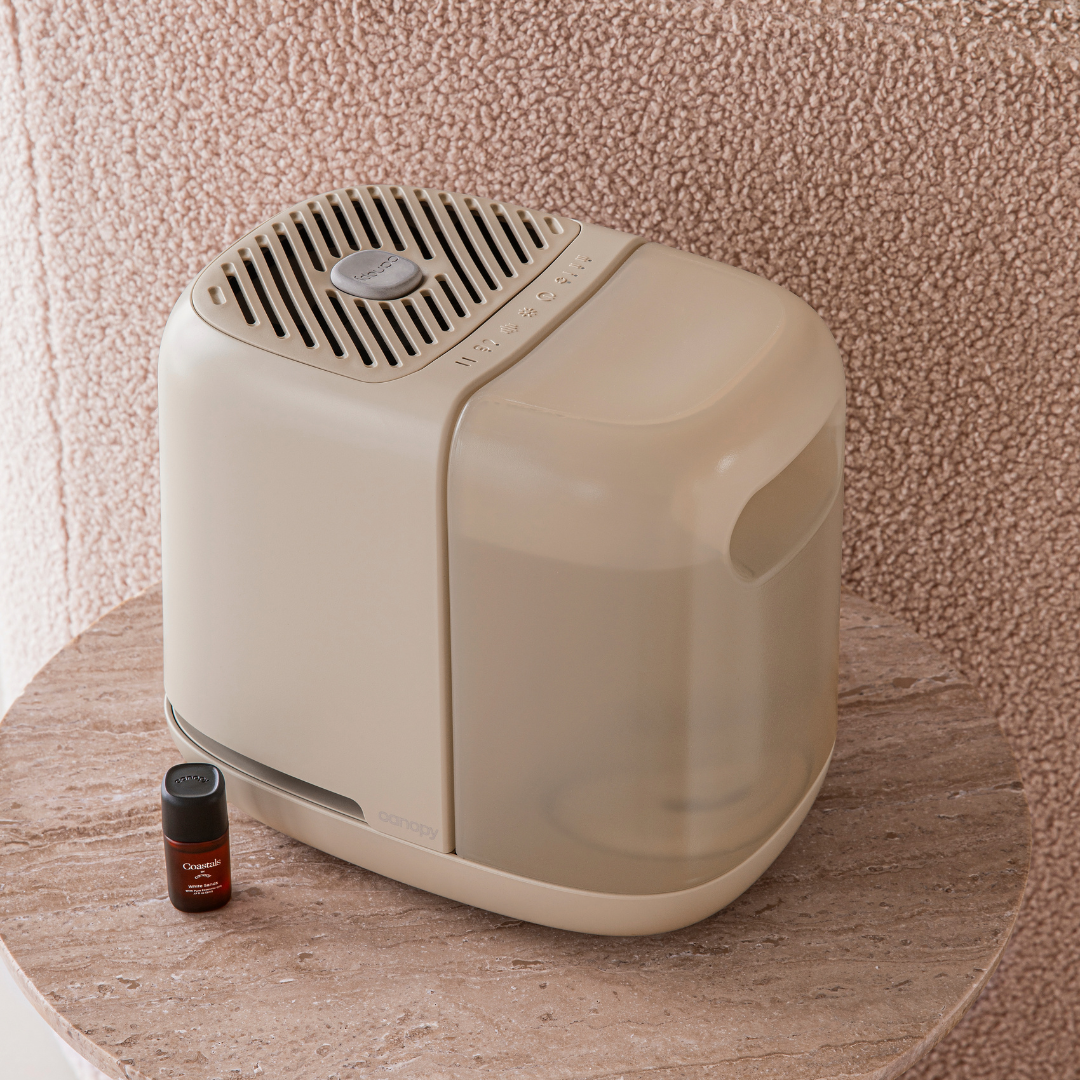 Cream Bedside Humidifier 2.0 sitting on a nightstand 